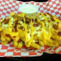 Mega Fries · Smothered with cheddar sauce, quest blanco and bacon. Served with ranch.