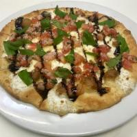 Flatbread Caprese · Fresh mozzarella and fresh basil, topped with marinated tomatoes and imported Parmesan chees...