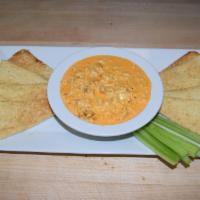 Buffalo Chicken Dip · Homemade dip with fresh chicken breast, hot sauce and a blend of cheeses. Served with sliced...