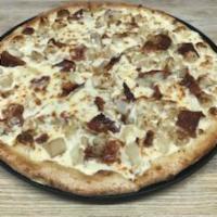 Chicken Carbonara Pizza · A blend of butter, Parmesan, cream, bacon, caramelized onions and tender chicken covered wit...
