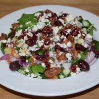 California Spinach Salad · Baby spinach, cucumbers, tomatoes, crumbled blue cheese, glazed pecans and dried cranberries...