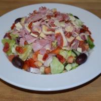Chopped Antipasto Salad · Blend of lettuce, tomatoes, cucumbers and roasted peppers topped with imported ham, capicola...