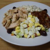 Cobb Salad · Grilled chicken, blend of lettuce, tomatoes,cucumbers, bacon, hard boiled egg and crumbled b...