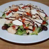 Chicken Caprese Salad · Grilled chicken, romaine lettuce, tomatoes, fresh mozzarella, roasted peppers and topped wit...