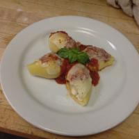 Stuffed Shells · Jumbo shells stuffed with ricotta. Served with garlic knots.