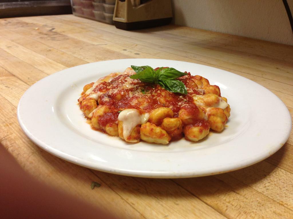 Gnocchi Caprese · Potato pasta tossed in marinara sauce and topped with melted provolone cheese. Served with garlic knots.