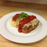 Eggplant Parmigiana · Layers of fresh battered eggplant, marinara sauce and a combination of high quality cheeses,...