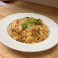 Shrimp Scampi · Sauteed in garlic and oil with a white wine tomato scampi sauce, served over spaghettini. Se...