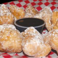 Zeppoli · Lightly fried Italian pastry dusted with powdered sugar. Served with chocolate dipping sauce.