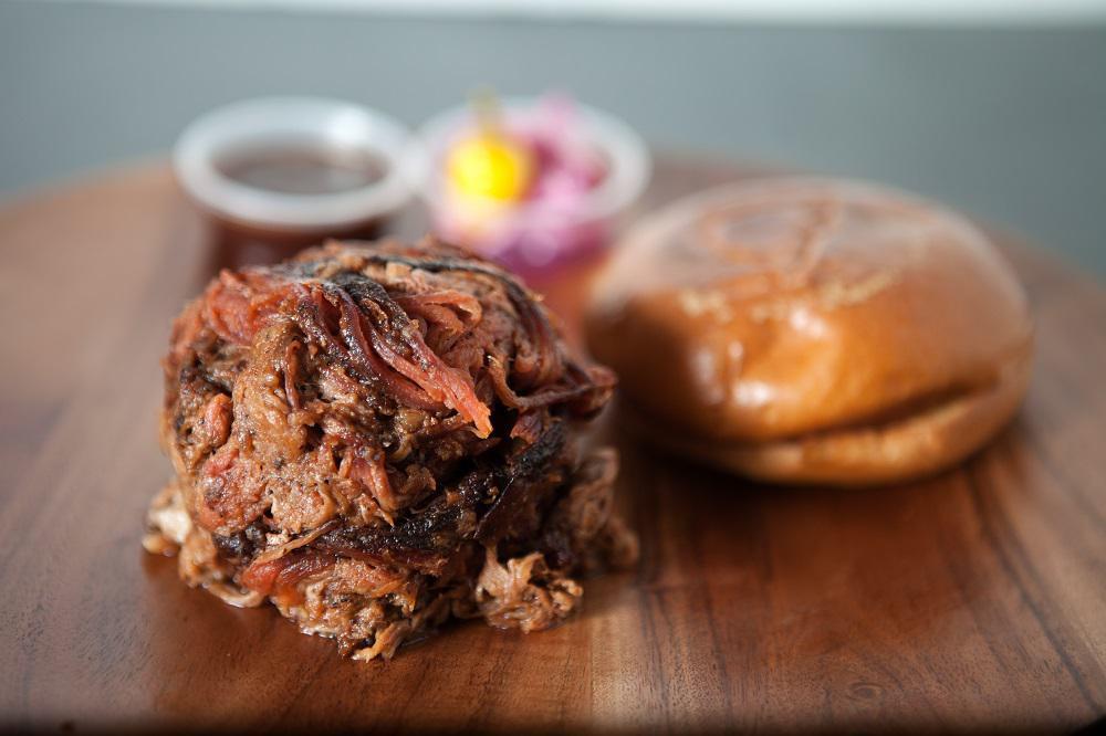 Pulled Pork Sandwich · 10 hours slow cooked hand-pulled pork shoulder. Glazed with our house-made bbq sauce. 