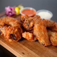Chicken Wings · 6-8 pieces. Fried chicken wings with seasoned salt sprinkle.