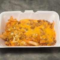 South of the Border Fries · Crisp french fries layered with seasoned beef, smothered with chile of your choice and toppe...