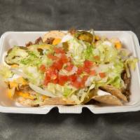 Loaded Nachos · White corn chips covered with seasoned beef, nacho cheese, jalapeno slices, lettuce, tomatoe...