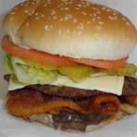 Mushroom Burger · 1/4 lb., Swiss cheese, mayo, bacon, grilled onion, grilled mushroom, tomato, lettuce on sesa...