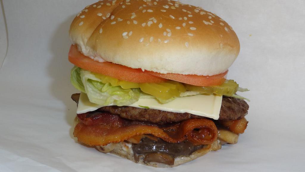Mushroom Burger · 1/4 lb., Swiss cheese, mayo, bacon, grilled onion, grilled mushroom, tomato, lettuce on sesame bun.