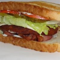 Sourdough Ranch Chicken Sandwich · Chicken patty, Swiss cheese, ranch, bacon, lettuce, tomato, pickle on sourdough bread.