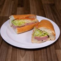 9. Bologna and American Cheese Sub · Lettuce, tomato and special seasoning.