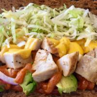 Jamaican Chicken Sandwich · Grilled chicken with melted cheddar cheese, avocado, lettuce, tomato, red onions and spicy r...