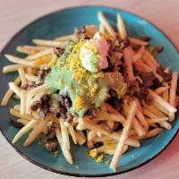 Carne Asada Fries · Your classic french fries topped with chopped grilled steak, cheese, sour cream and guacamole.