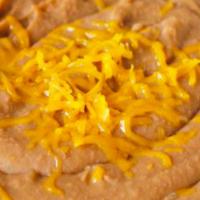 Beans (8oz) · 8oz of refried beans topped with yellow cheese