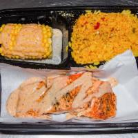 Salmon platter · Grilled Salmon and grilled shrimp over top of Yellow Rice And Gold sauce added