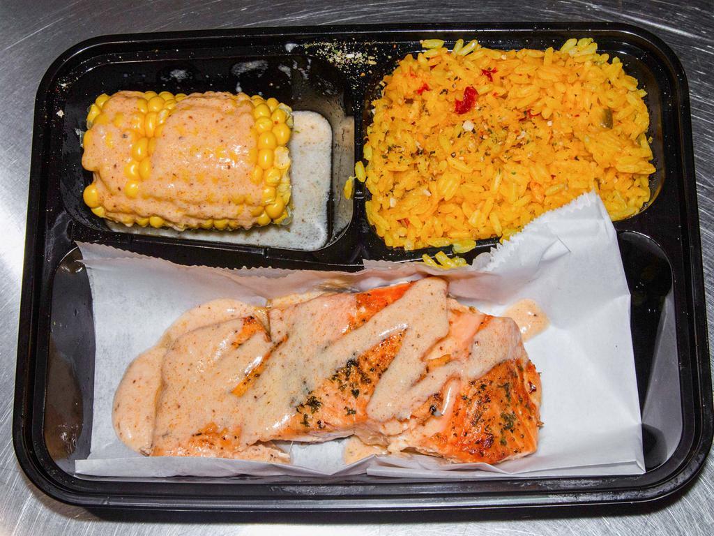 Salmon platter · Grilled Salmon and grilled shrimp over top of Yellow Rice And Gold sauce added