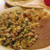 Machaca con Huevo · Dry meat with eggs.