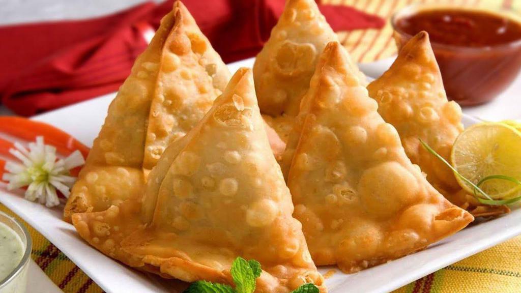 Samosa · Deep fried patty stuffed with potatoes, green peas and ground Indian spices.