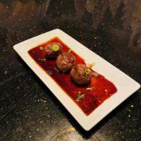 Kobe and Foie Gras Meatballs · American Wagyu stuffed with Camus VS Cognac scented Foie Gras, Sherry Demi, Scallions