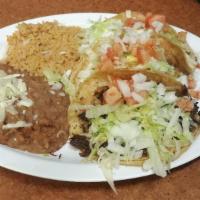 Taco Dinner · 3 Tacos topped with lettuce, tomato, onion, and cheese. Served with rice and beans.