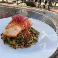 Salmon · Seared salmon, quinoa, red and yellow peppers, arugula, roasted corn, ancho pepper sauce, pi...