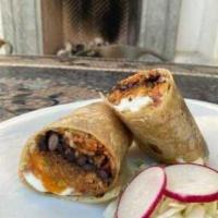 Cochinito Burrito · Cinnamon and orange braised pork, cabbage, lime crema, heirloom habanero salsa, pickled onio...