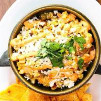 Mexican Street Corn · Grilled corn, cotija, cilantro, onion, garlic, chiptole aioli, crema, jack cheese