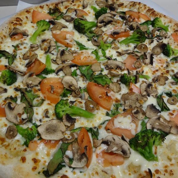 Capri Pizza · Fresh spinach, broccoli, tomatoes, mushrooms, garlic, ricotta and whole milk mozzarella cheese.