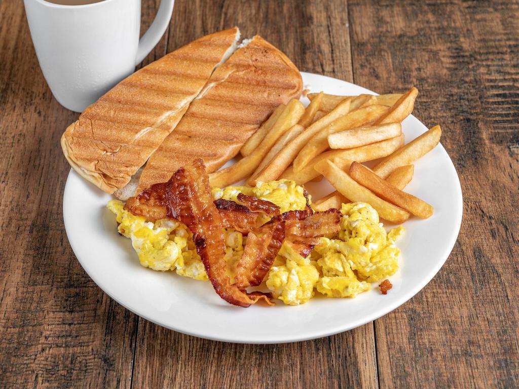 American style breakfast #1 · Built with your style egg, cheddar cheese, bacon or ham, french fries, small coffee, and cuban toast.