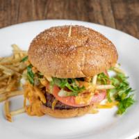 Cheeseburger · Grilled patty on a bun. Built with lettuce, tomato, your style onions, potato sticks with ou...