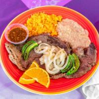 Mexican Bistec · Slice of beef accompanied by rice, beans, and tortillas! Prepared however you'd like your or...
