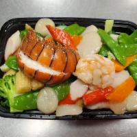 S14. Seafood Delight · Lobster tail, jumbo shrimp, scallops, king crab meat sauteed with mixed vegetables in specia...