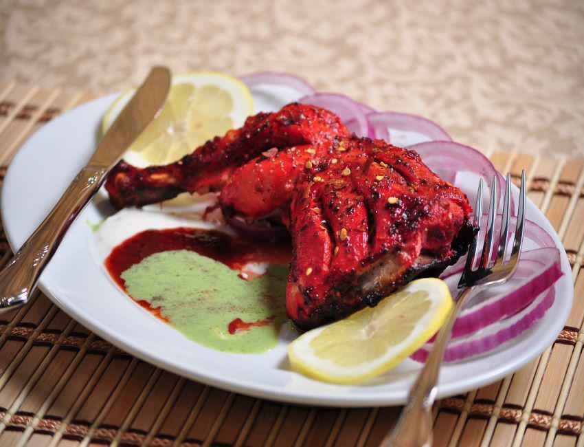 Chicken Leg Tandoori · On the bone tender chicken marinated in yogurt and spices.