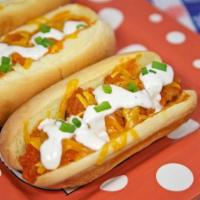 Tenders Dog · Crispy Buffalo Tenders + Toasted Bun + Hot and Spicy Honey Drizzle + Coleslaw + Pickles
