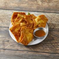 4. Crab Rangoon · 6 pieces. Fried wonton wrapper filled with crab and cream cheese. 