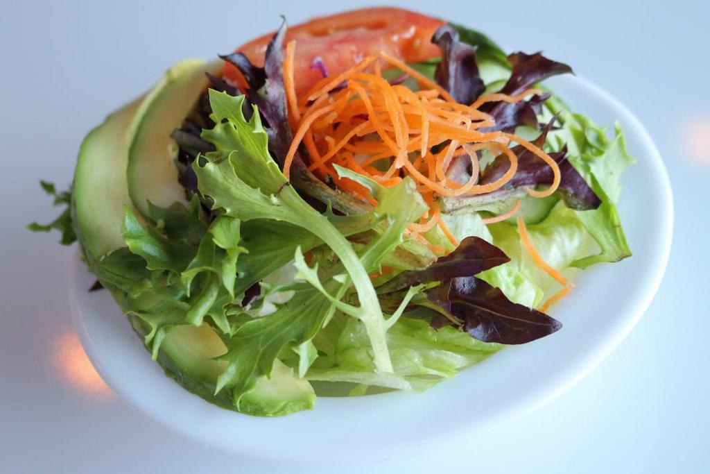 House Salad · Lettuce, carrots, red cabbage, tomatoes, spring mix and avocado with ginger dressing