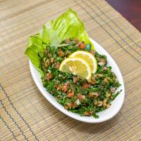 Tabouli Salad · Fresh parsley, mint, wheat bulgur, ripe tomatoes, onions, lemon, and olive oil.