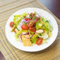Fattoush Salad · Romaine, tomato, cucumber, radish, green peppers, onion, toasted pita, sumac served with a l...