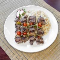 Lamb Kebab · 2 skewers of charbroiled marinated lamb grilled over an open flame served with rice pilaf. G...