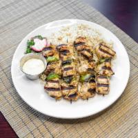 Chicken Shish Taouk · 2 skewers of marinated chicken breast grilled over an open flame served with rice pilaf. Glu...