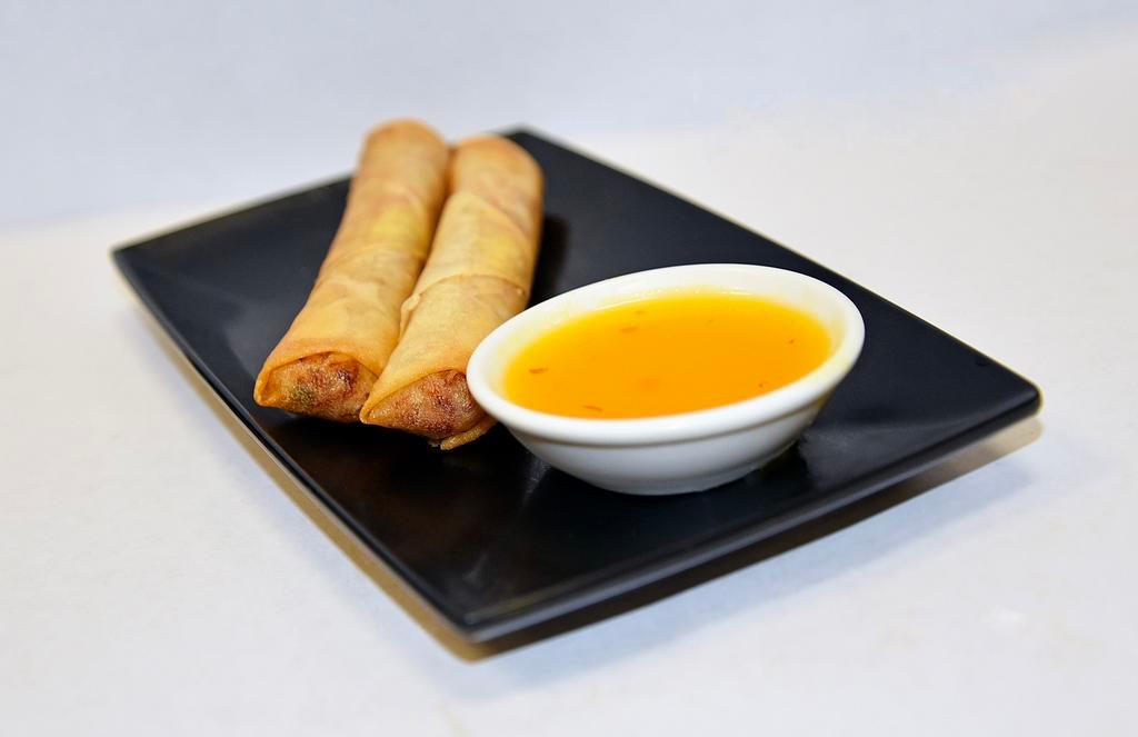 2 Spring Rolls · Cabbage, celery, carrots, and bean thread noodles wrapped in a spring roll wrapper. Served with plum sauce.