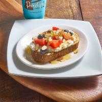 Honey Berry Toast · Toast, cream cheese, sliced strawberries, blueberries and almonds drizzled with honey.