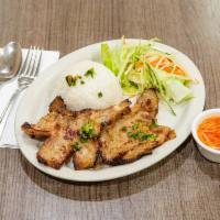 34. Grilled Pork or Pork Chop Rice · Served with white rice, vegetable, and house special sauce.

