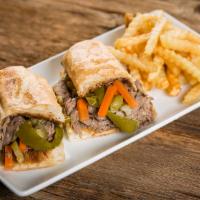 Italian Beef Sandwich + French Fries · Sliced thin & piled high on Italian bread. Sweet peppers or hot giardiniera on sandwich comp...